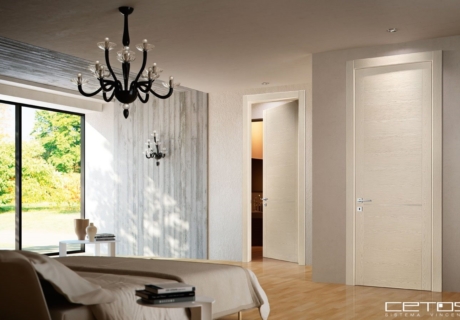 PORTE INTERNE IN LEGNO A BATTENTE CON INSERTI IN ACCIAIO